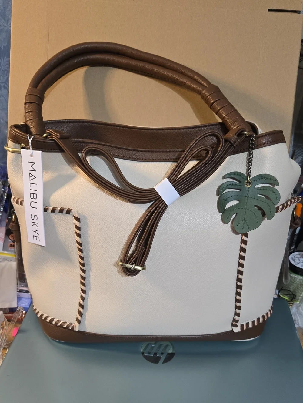 Malibu Skye Cream Hobo Bag with Green Leaf Charm and Cosmetic Pouch